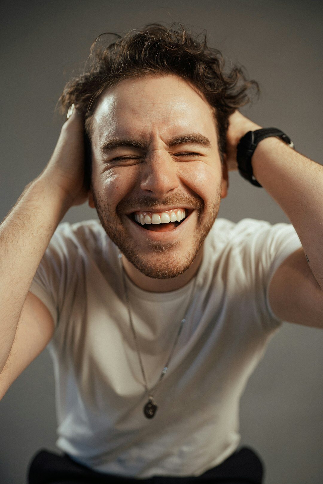 Studio portrait of a smiling white man