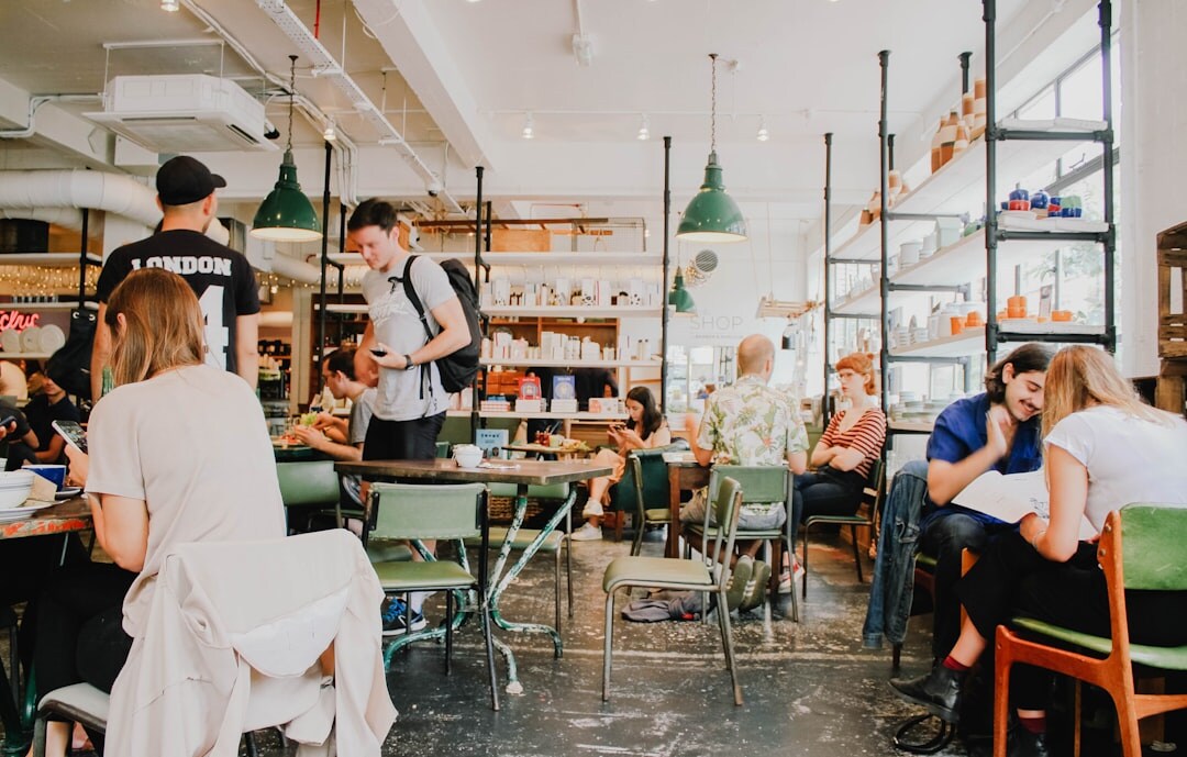 Group of people chatting around a table in a cozy café