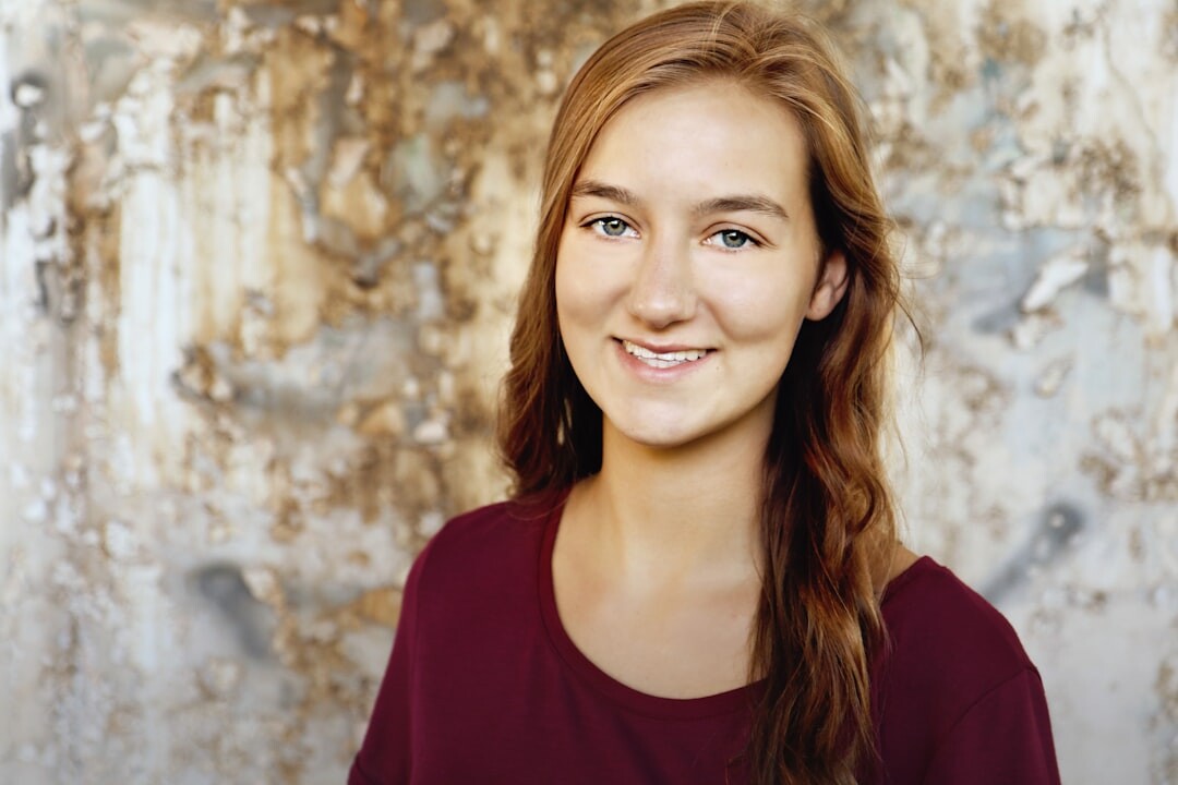 Studio portrait of a smiling young white woman