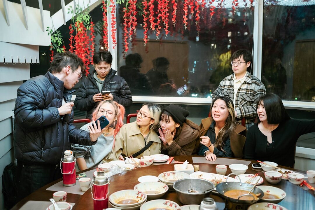Family talking and smiling around the dinner table